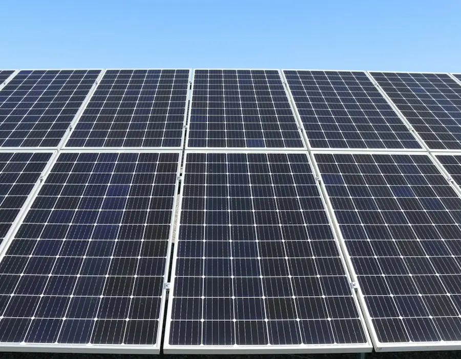 An array of solar panels under clear sky